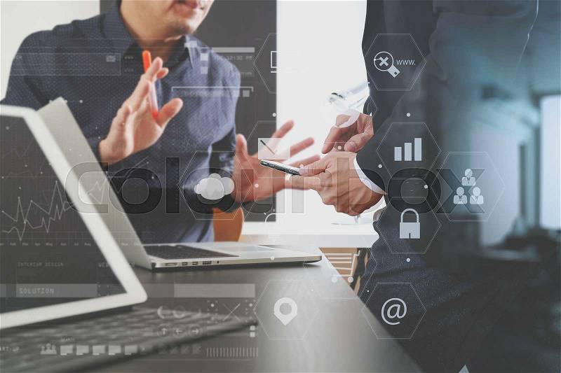 Co working team meeting concept,businessman using smart phone and digital tablet and laptop computer in modern office with virtual graph chart and icon diagram , stock photo