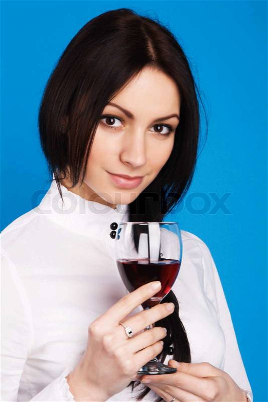 Beautiful young lady holding a glass of wine, face portrait, stock photo