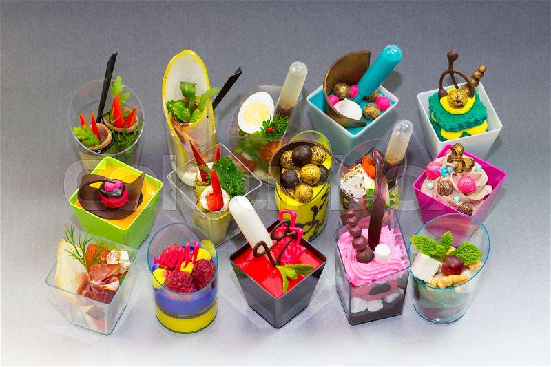 Molecular cuisine dishes in plastic buffet tableware, stock photo