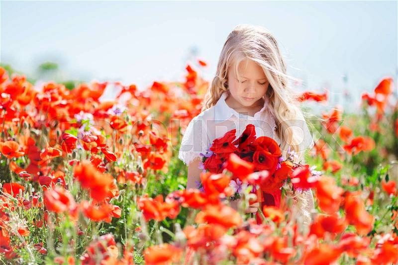 Portrait of beautiful happy sad girl with long blonde hair is holding bouquet of poppies and purple flowers, spring time, stock photo