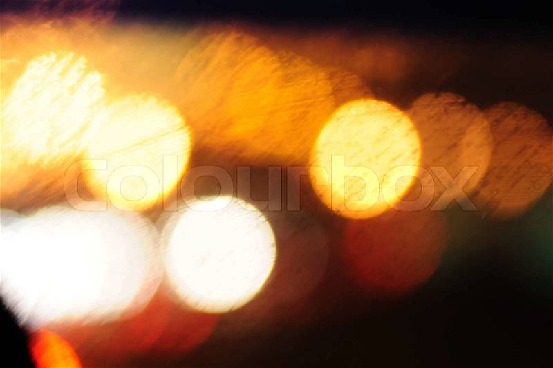 This photograph represent abstract city blurred lights in warm tones, stock photo