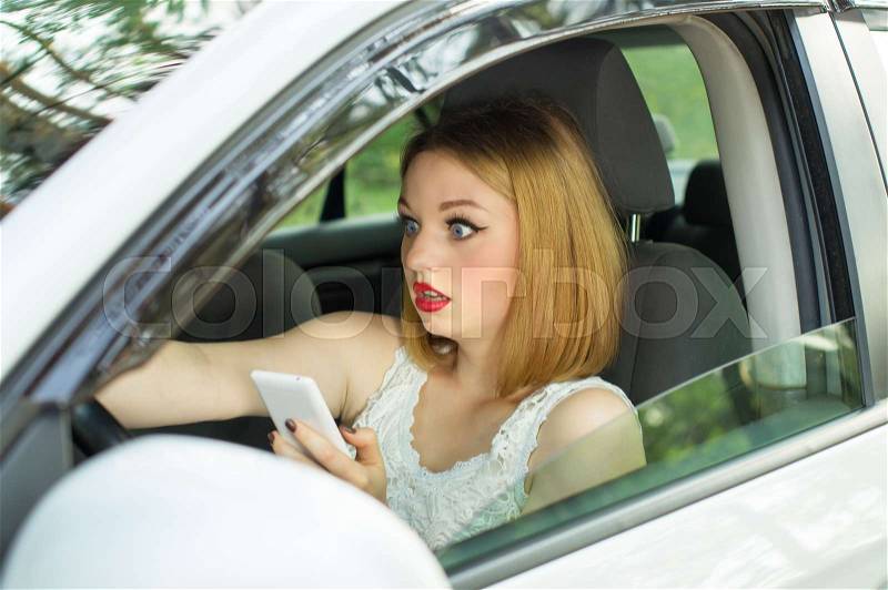 Young girl, holding phone in hand looked directly, creating an emergency situation, stock photo