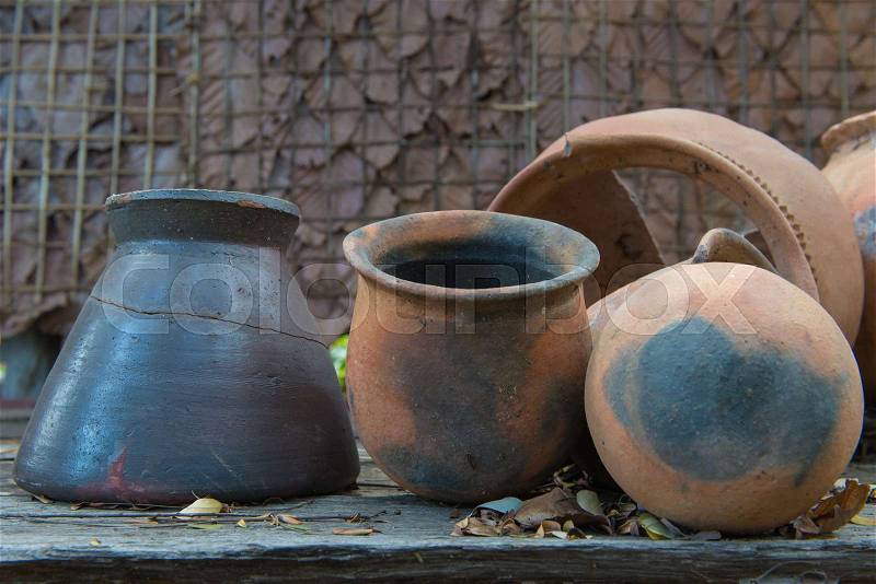 Broken antique clay pot or traditional Jar on abandoned hut, stock photo