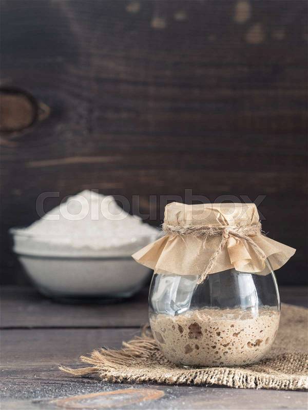 Rye sourdough starter and rye flour, stock photo
