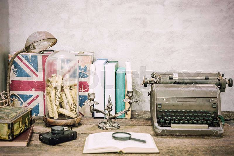 Closeup of workplace with open book stationery items and retro lamp on wooden table with white concrete background.Vintage filtered. Education concept. Reading and researching concept, stock photo