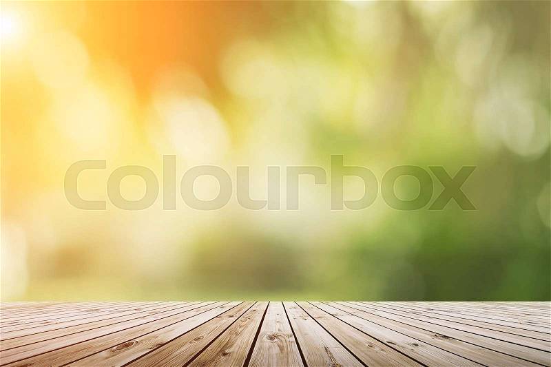 Blur green nature bokeh with sun light on copy space empty, old wood plank abstract background. Product presentation with fresh nature, stock photo