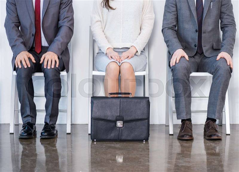 Businesspeople sitting in queue and waiting for interview in office, business concept, stock photo
