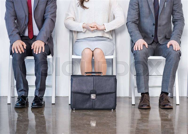 Businesspeople sitting in queue and waiting for interview in office, business concept, stock photo
