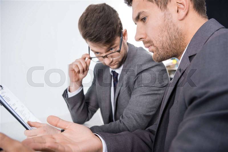 Side view of successful businessmen discussing job interview contender, stock photo