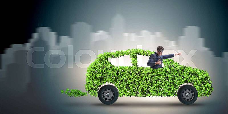 Businessman in green electric car concept, stock photo