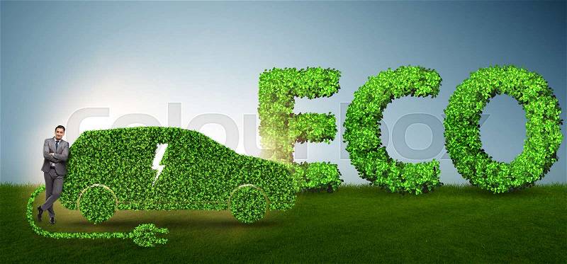 Businessman in green electric car concept, stock photo