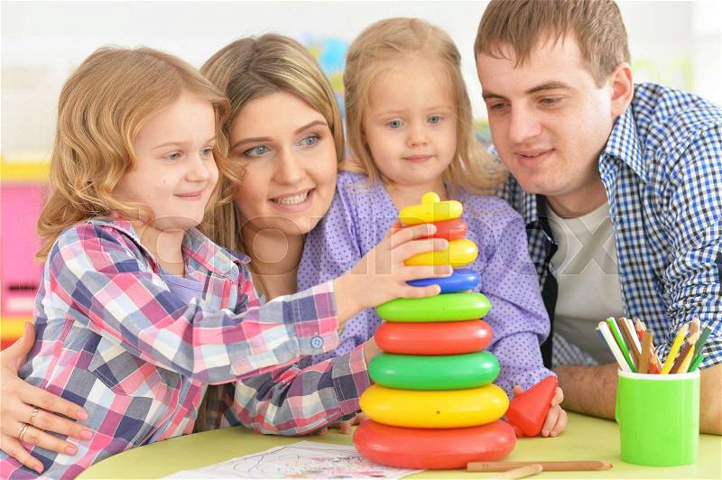 Portrait of a friendly happy family playing together, stock photo