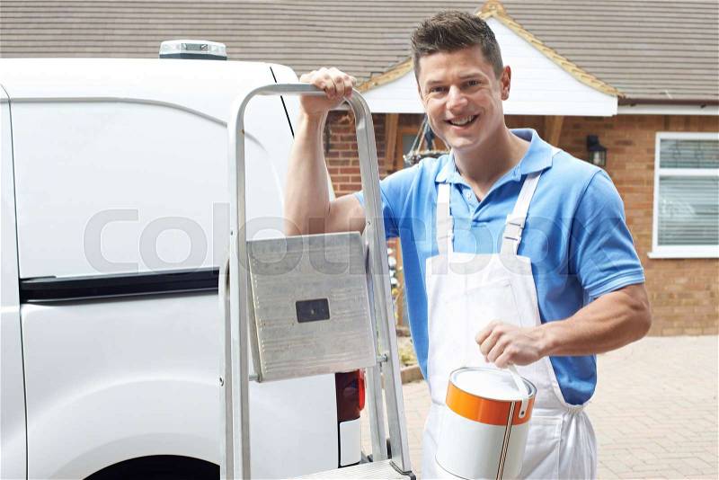 Portrait Of Decorator Standing Outside Domestic Home, stock photo