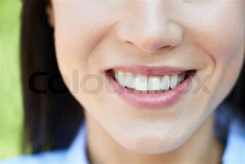 Close Up Of Woman With Beautiful And Perfect Teeth, stock photo