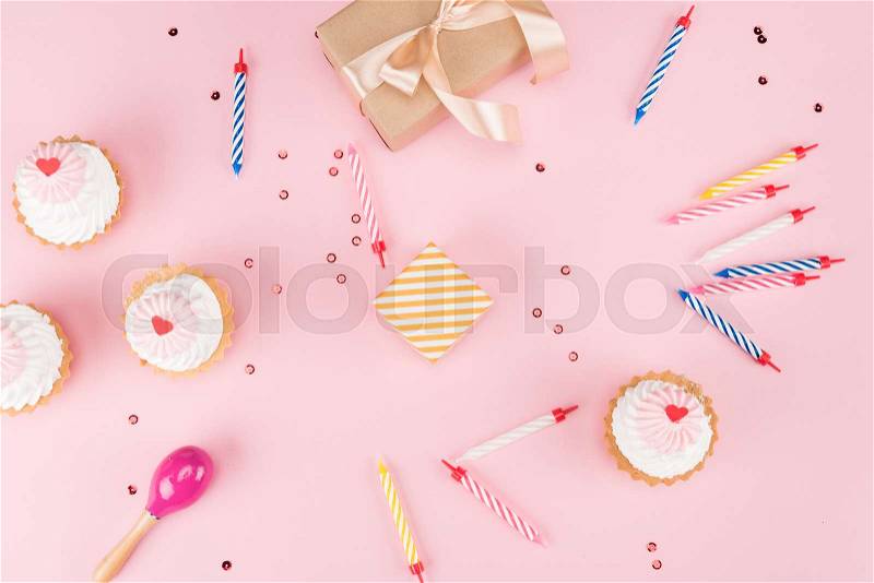 Top view of cakes with candles and gift boxes with confetti mock-up, birthday party, stock photo