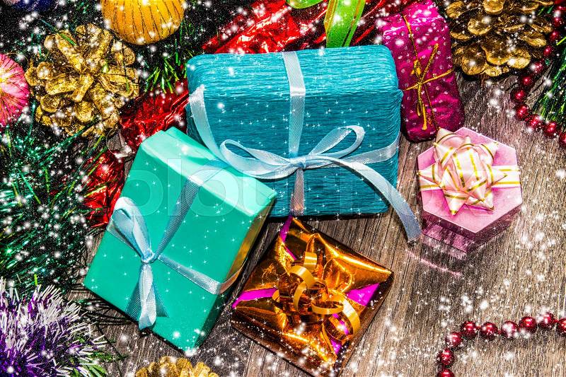 New year picture. Gifts boxes, Christmas decorations, tinsel and beads, stock photo