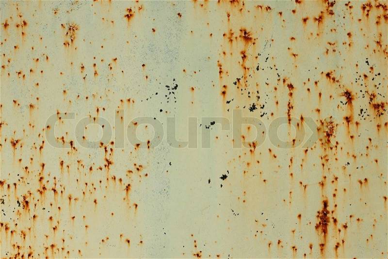 Old painted metal surface with shelled paint and rusty smudges, stock photo
