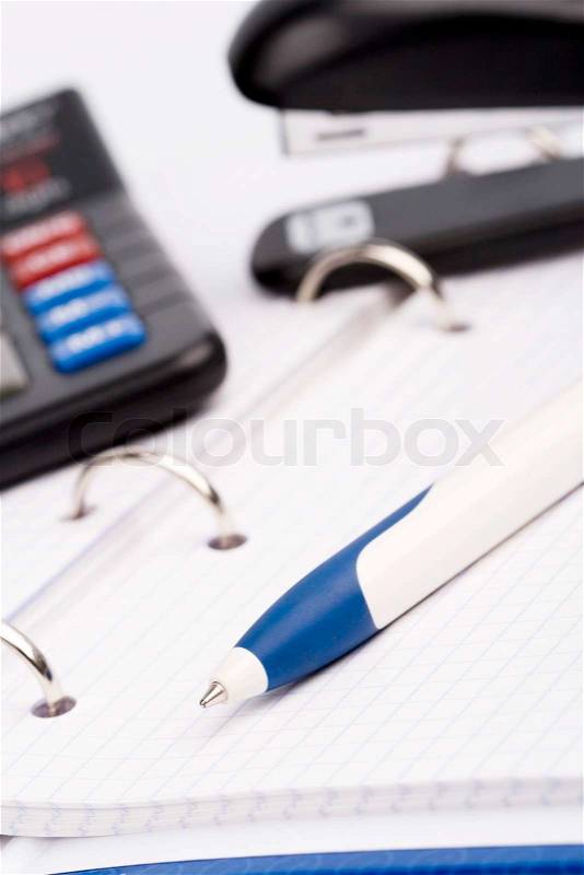 Office item - business organizer, pen, calculator and stapler, stock photo