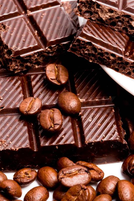 Coffee beans with black chocolate closeup, stock photo