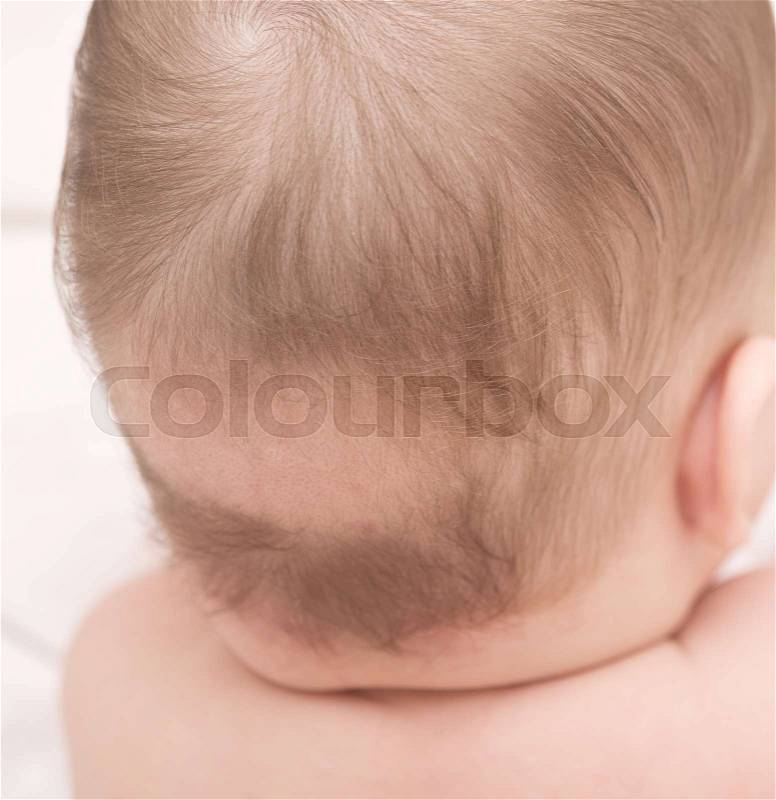 Close up of baby bald patch, stock photo