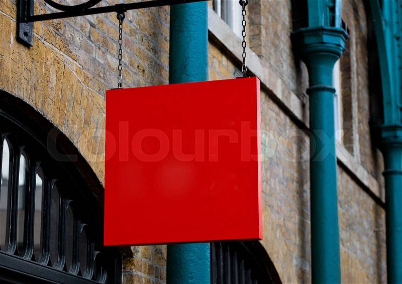 Red square display billboard plate in the city on brick wall, stock photo