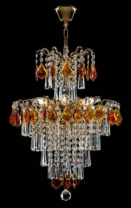 Large crystal chandelier isolated on black background. Luxury royal expensive chandelier for living room, Hall of celebration, stock photo