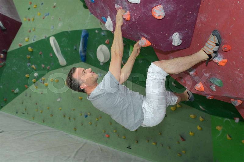 Indoor rock climbing, stock photo