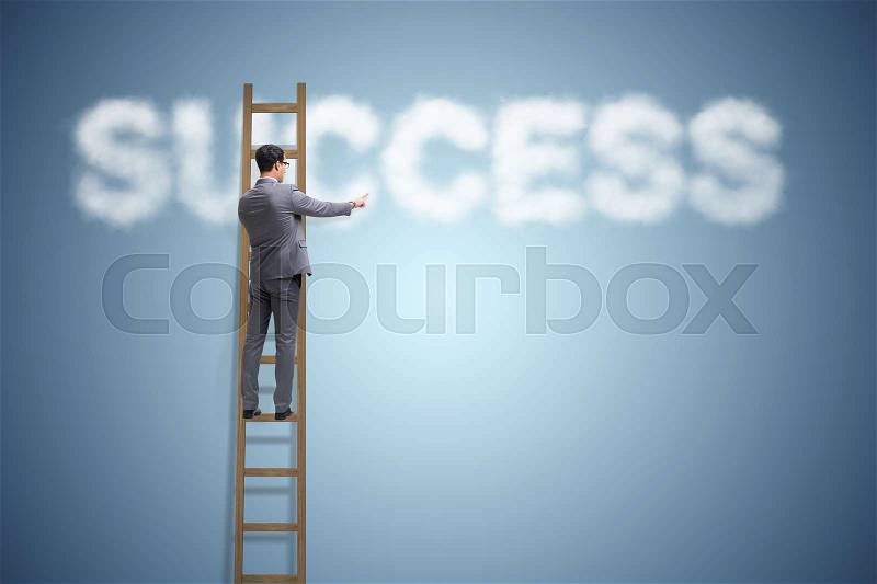 Businessman reaching success with career ladder, stock photo