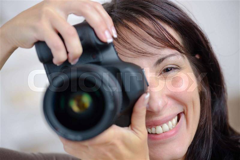 Happy photographer with camera, stock photo