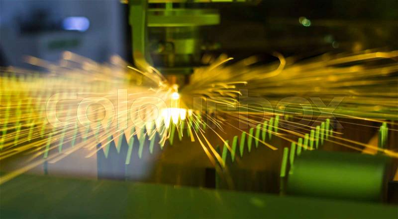 Technology, High precision manufacturing concept.CNC Industrial laser cutting steel metal with bright sparks/ Intermarch 2017 Industrial Machinery Exhibition at Bitech Thailand - May 2017 , stock photo