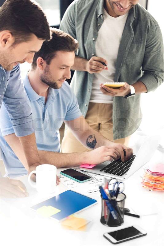Casual businessmen working on new project at modern office, business teamwork, stock photo