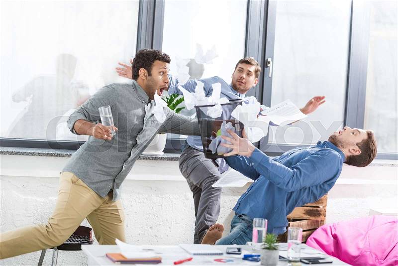 Portrait of young business team having fun in office, business teamwork, stock photo