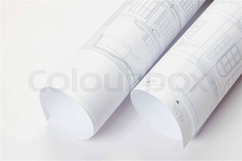 Architectural plan in roll on white background, stock photo