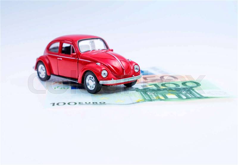Model car and money - buy a car, stock photo
