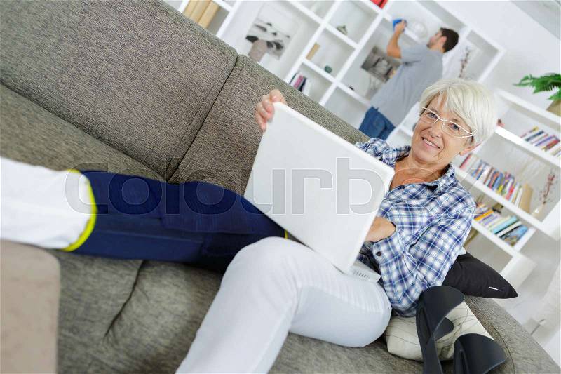 Using the apple brand of computer, stock photo