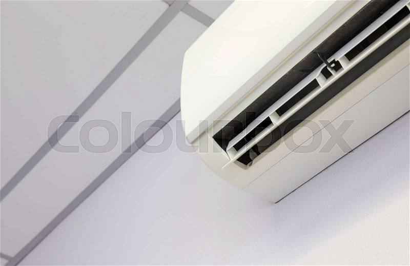 Cool air conditioner system on white wall room, stock photo