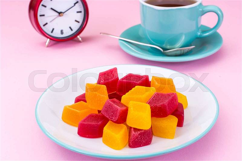 Fruit jelly and tea for dessert. Studio Photo , stock photo