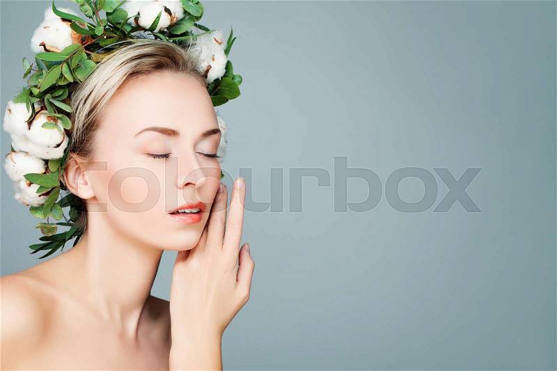 Spa Woman with Green Leaves and Cotton Flowers Wreath. Beautiful Spa Model, stock photo