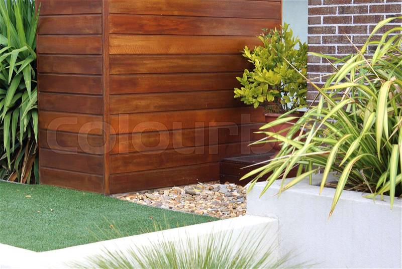 Combination of timber, plants, artificial grass, brick and wall , stock photo