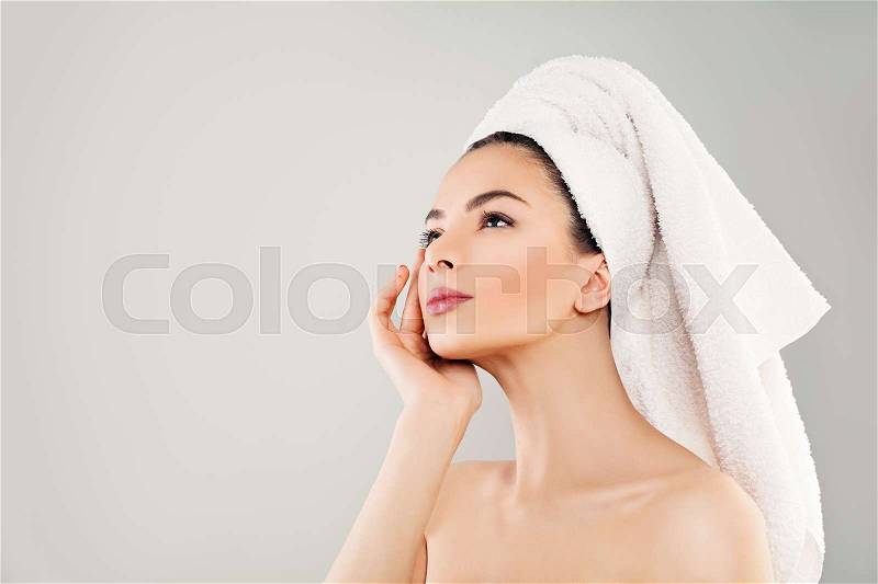 Spa Beauty. Cute Young Woman with Healthy Skin Looking Up, stock photo