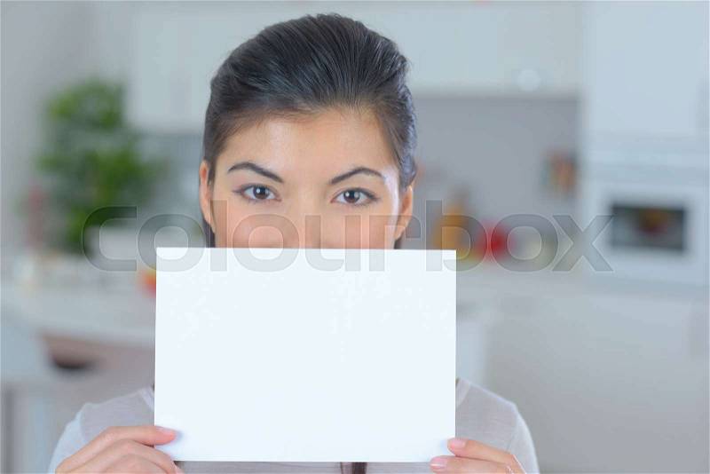 Beautiful woman with a paper in the hands, stock photo