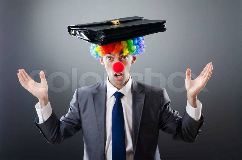 Clown businessman in funny business concept, stock photo