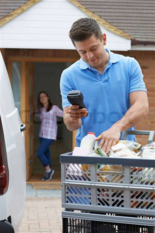 Driver Delivering Online Grocery Order, stock photo