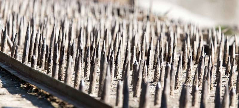 Sharp metal stakes for scaring animals like a background, stock photo