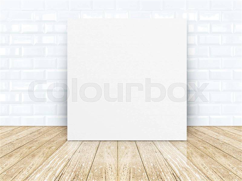 Poster frame at tiles ceramic wall and wooden floor, stock photo