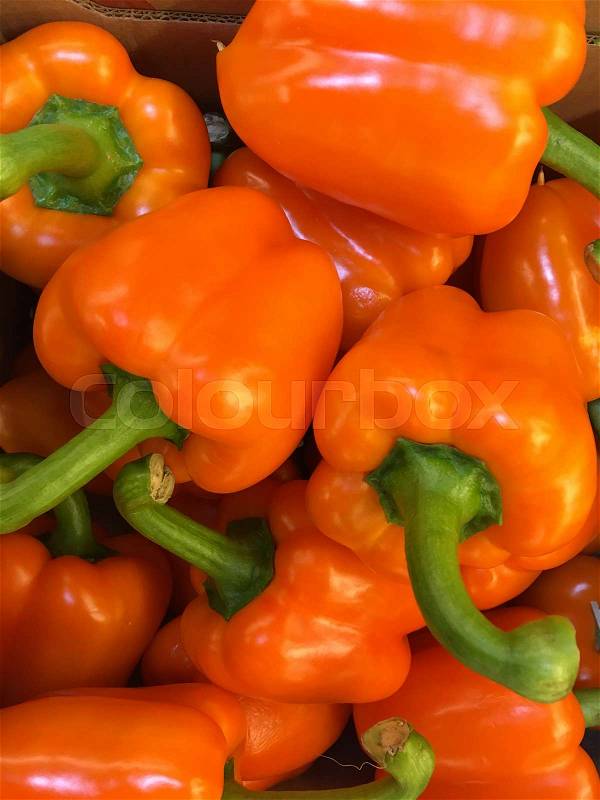 Top view of yellow peppers in a pile, stock photo