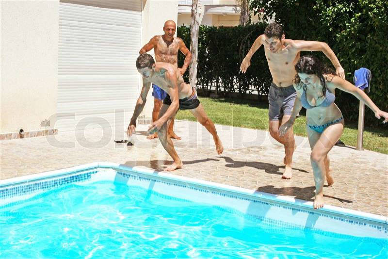 People jumping to swimming pool, stock photo