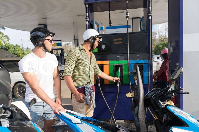 Man Couple On Gas Station Fuel Motor Bike, Happy Smiling Guys Travelling Buy Patrol, stock photo