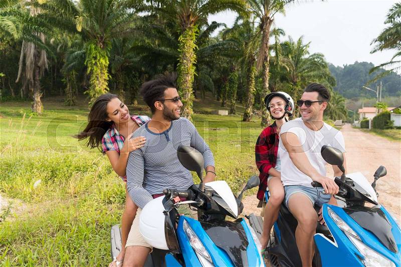 Two Couple Riding Motorbike, Young Man And Woman Travel On Bike On Tropical Forest Road During Exotic Summer Holiday, stock photo
