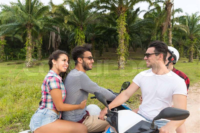 Two Couple Riding Motorbike, Young Man And Woman Travel On Bike On Tropical Forest Road During Exotic Summer Holiday, stock photo